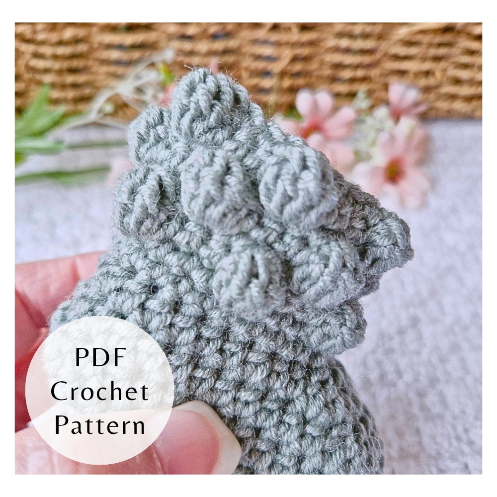 Close up of bobbles on bootie cuff of crochet pattern for baby booties by Twisted by the Sea. Digital PDF download featuring US crochet terms and step-by-step photos.