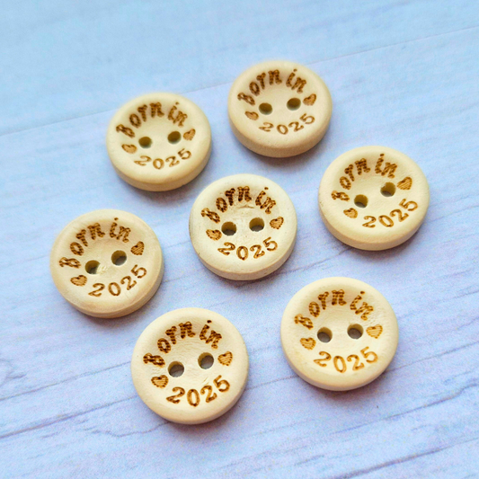 Handmade Born In 2025 Wooden Buttons – 15mm Natural Craft Buttons – Pack of 10, for Sewing, Knitting, Crochet – Buttons crafted in soft acrylic yarn and available in multiple colours by Twisted by the Sea.