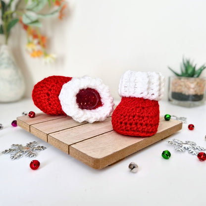 A pair of red and white crocheted booties