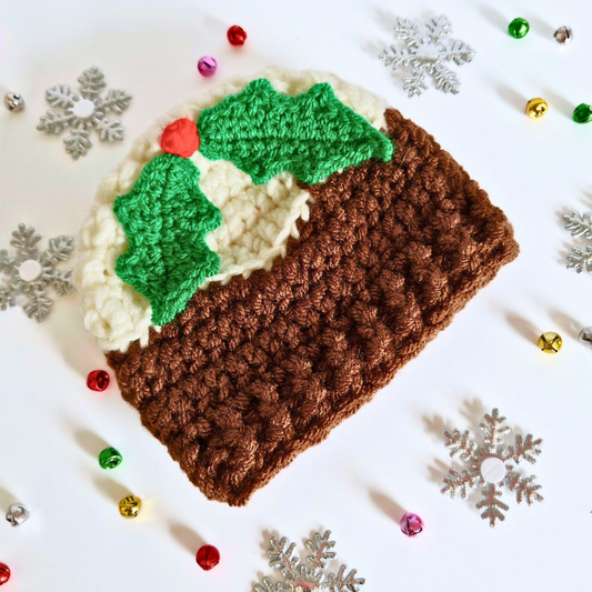 Handmade Christmas Pudding Baby Hat with Holly & Berry – Beanie Hat crafted in soft acrylic yarn and available in multiple colours by Twisted by the Sea.