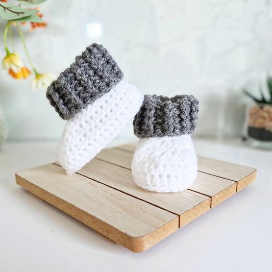 Handmade Handmade White Crochet Baby Booties with Coloured Cuff – Newborn Gift Idea – Baby Booties crafted in soft acrylic yarn and available in multiple colours by Twisted by the Sea.