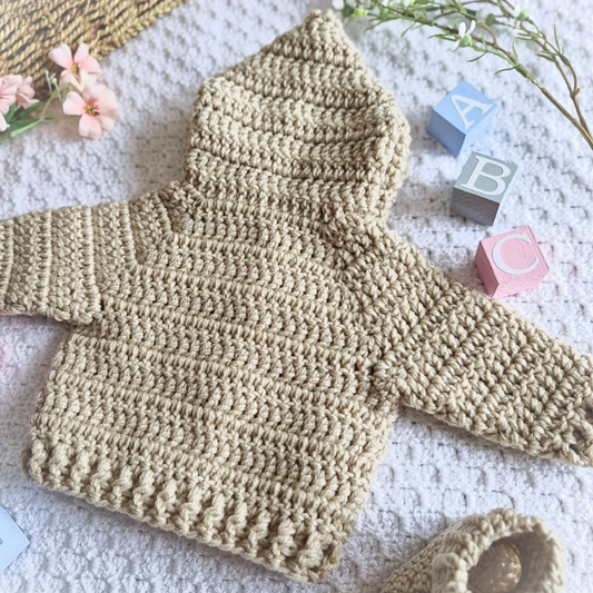 Handmade Crochet Baby Hooded Cardigan – Newborn to 12 Months – Baby Toddler Cardigans crafted in soft acrylic yarn and available in multiple colours by Twisted by the Sea.