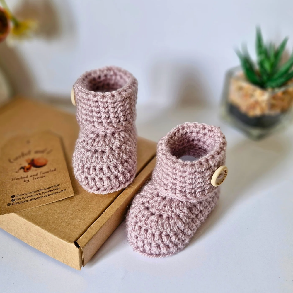Handmade Born in 2025 Crochet Baby Booties – Handmade Keepsake Gift for Newborns – Baby Booties crafted in soft acrylic yarn and available in multiple colours by Twisted by the Sea.