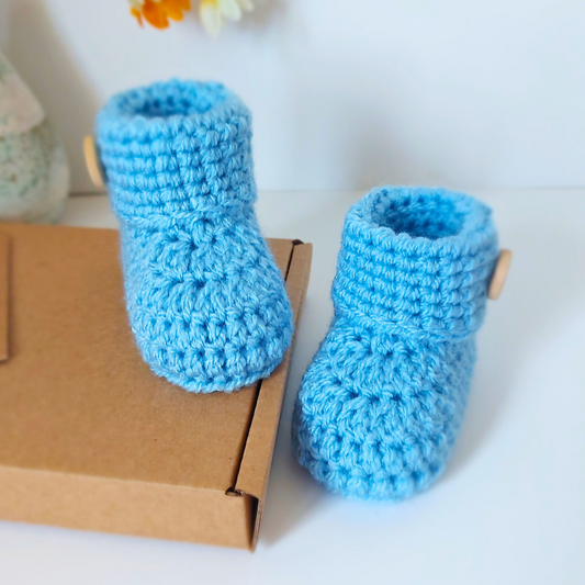 Handmade Soft Crochet Baby Booties – ‘It’s a Boy’ Newborn Shoes & Baby Shower Gift – Baby Booties crafted in soft acrylic yarn and available in multiple colours by Twisted by the Sea.