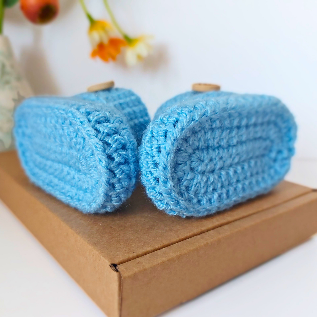 Handmade Soft Crochet Baby Booties – ‘It’s a Boy’ Newborn Shoes & Baby Shower Gift – Baby Booties crafted in soft acrylic yarn and available in multiple colours by Twisted by the Sea.