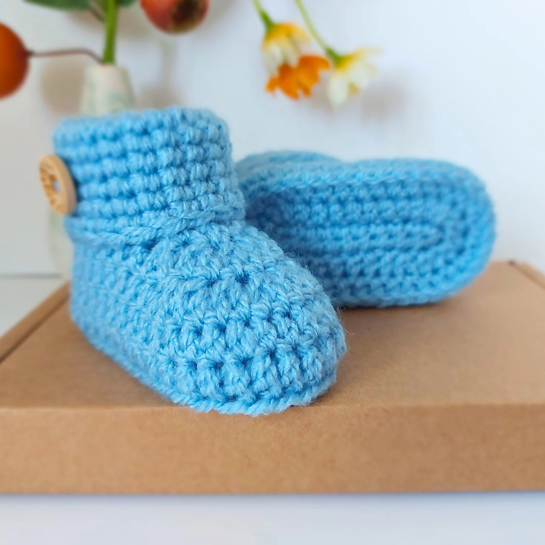 Handmade Soft Crochet Baby Booties – ‘It’s a Boy’ Newborn Shoes & Baby Shower Gift – Baby Booties crafted in soft acrylic yarn and available in multiple colours by Twisted by the Sea.
