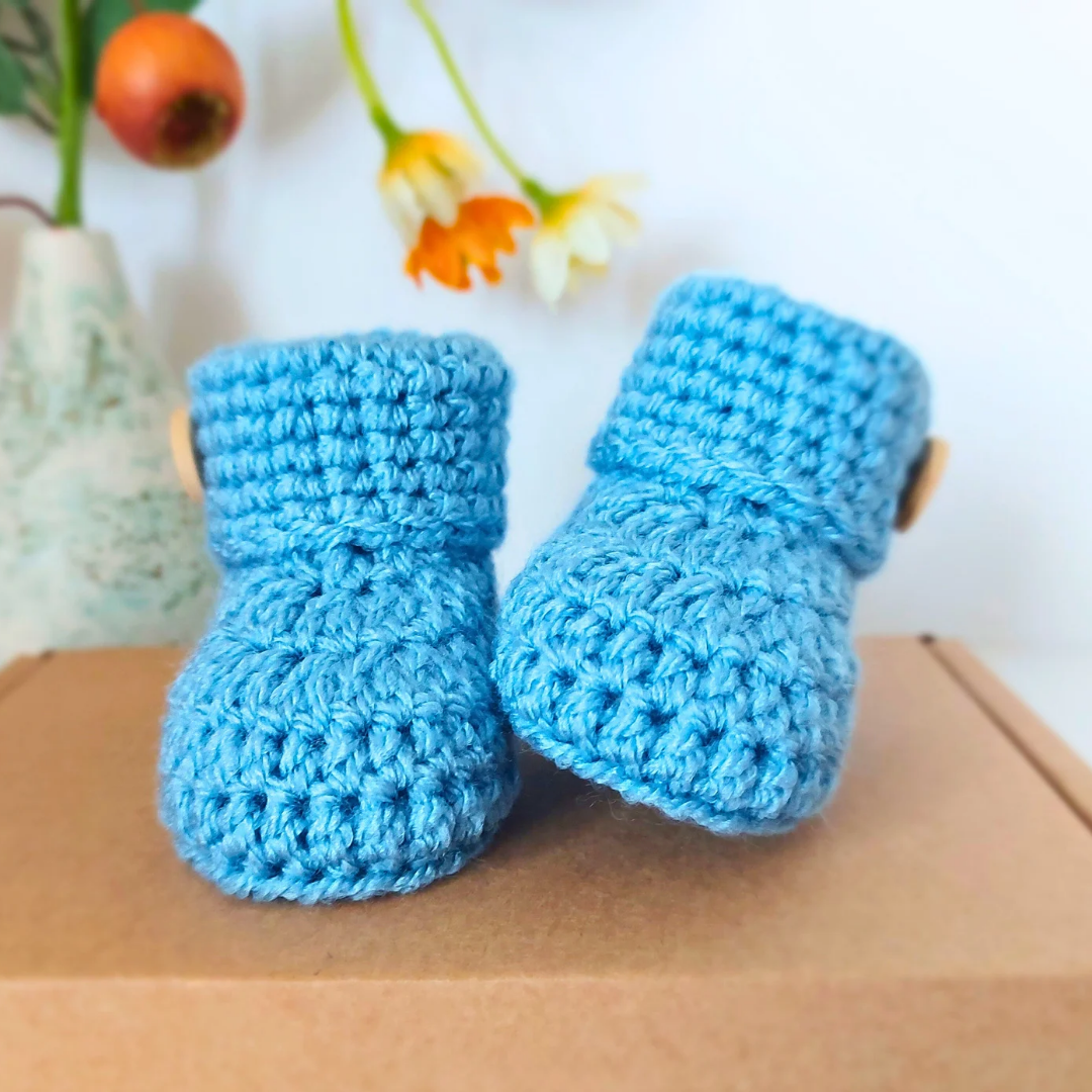 Handmade Soft Crochet Baby Booties – ‘It’s a Boy’ Newborn Shoes & Baby Shower Gift – Baby Booties crafted in soft acrylic yarn and available in multiple colours by Twisted by the Sea.