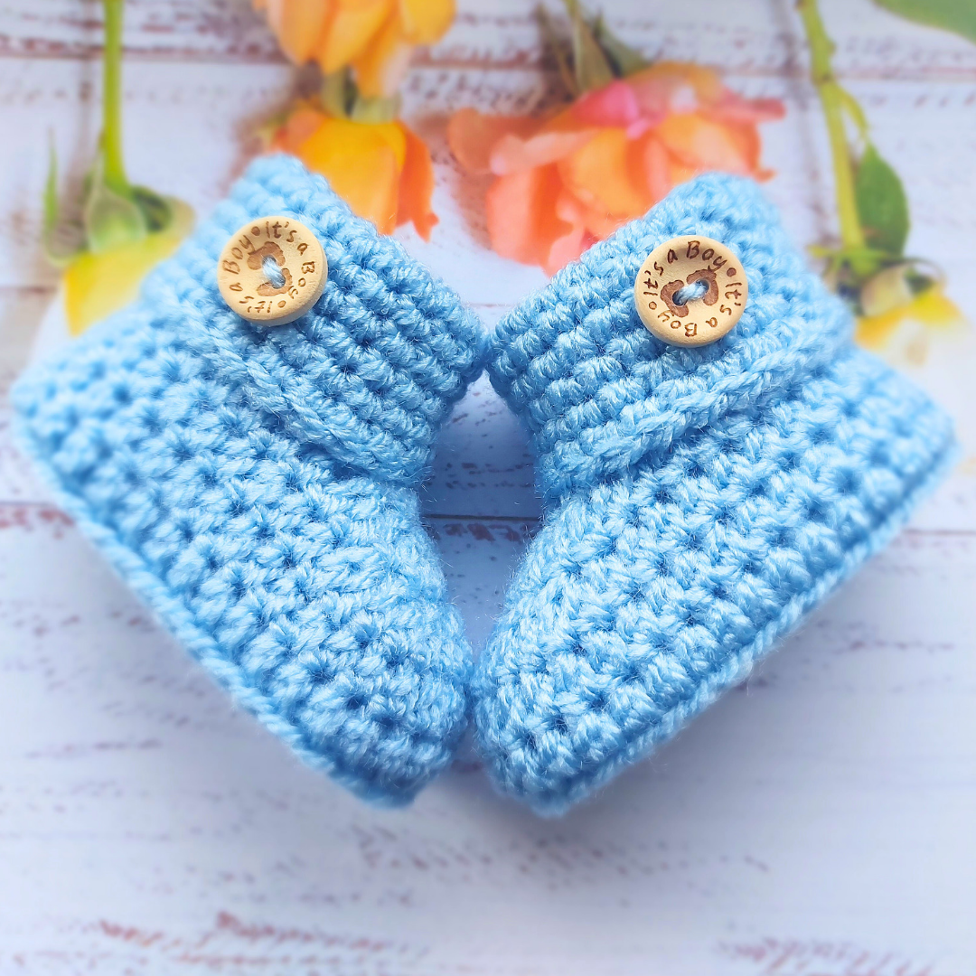 Handmade Soft Crochet Baby Booties – ‘It’s a Boy’ Newborn Shoes & Baby Shower Gift – Baby Booties crafted in soft acrylic yarn and available in multiple colours by Twisted by the Sea.