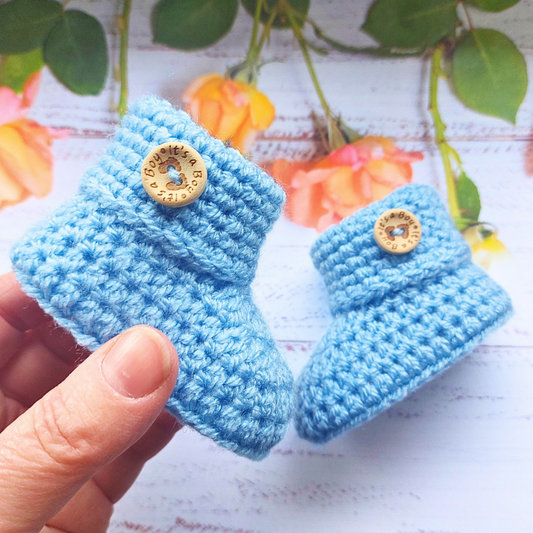 Handmade Soft Crochet Baby Booties – ‘It’s a Boy’ Newborn Shoes & Baby Shower Gift – Baby Booties crafted in soft acrylic yarn and available in multiple colours by Twisted by the Sea.