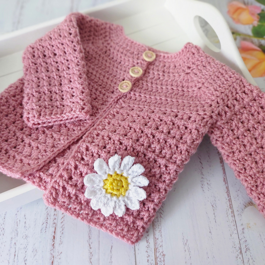 Handmade Crochet Daisy Baby Cardigan – Handmade in sizes 12 to 24 Months – Baby Toddler Cardigans crafted in soft acrylic yarn and available in multiple colours by Twisted by the Sea.