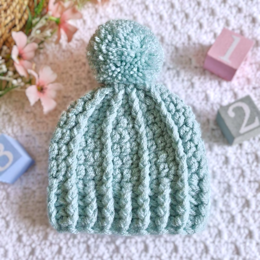 Handmade Handmade Crochet Pom Pom Baby Hat – Newborn to 12 Months – Beanie Hat crafted in soft acrylic yarn and available in multiple colours by Twisted by the Sea.