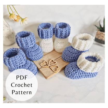 Seamless crochet baby booties with a textured ridged cuff. Beginner friendly PDF pattern by Twisted by the Sea, digital.