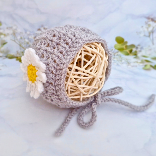Handmade Handmade Crochet Daisy Baby Bonnet – Newborn to 12 Months – Beanie Hat crafted in soft acrylic yarn and available in multiple colours by Twisted by the Sea.