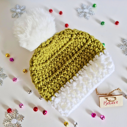 Handmade Handmade Christmas Baby Hat – Mistletoe Green & White Pom Pom Beanie (Newborn to 6 Months) – Pom Pom Hat crafted in soft acrylic yarn and available in multiple colours by Twisted by the Sea.