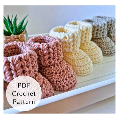 Textured puff V stitch crochet baby booties with a seamless fold-over cuff. Intermediate PDF pattern by Twisted by the Sea.