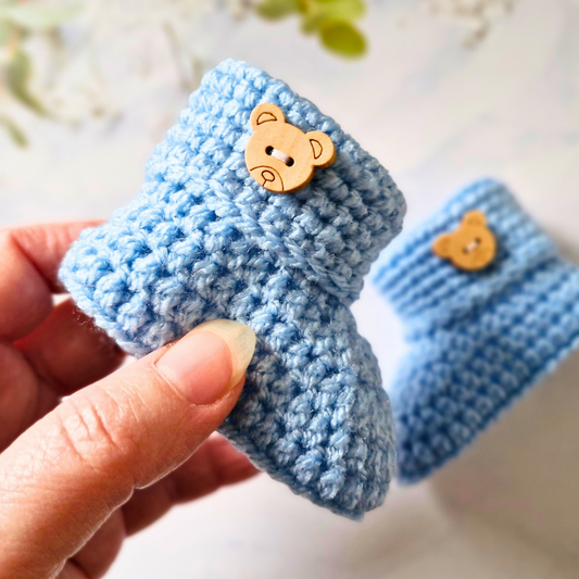 Handmade Handmade Crochet Baby Booties with Teddy Button - Sizes Newborn, 0-3 and 3-6 Months – Baby Booties crafted in soft acrylic yarn and available in multiple colours by Twisted by the Sea.