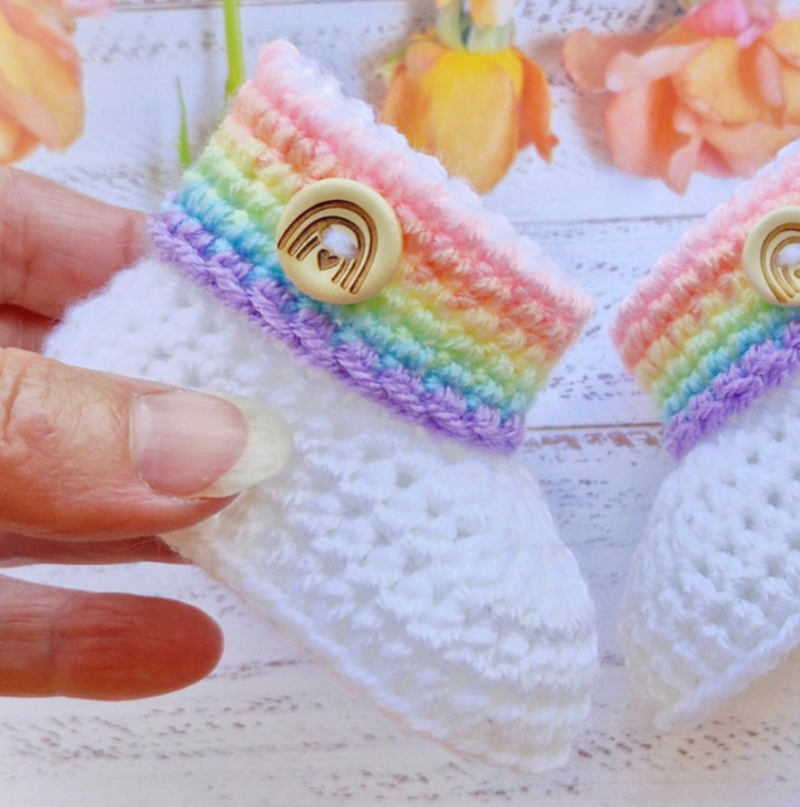 Handmade Rainbow Baby Crochet Booties, Gender Neutral Keepsake Gift – Baby Booties crafted in soft acrylic yarn and available in multiple colours by Twisted by the Sea.