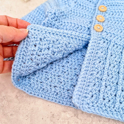 A biew of the inside stitching of the cardigan