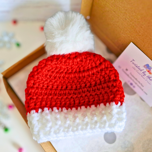 Handmade Handmade Christmas Baby Hat – Red & White Pom Pom Beanie (Newborn to 6 Months) – Pom Pom Hat crafted in soft acrylic yarn and available in multiple colours by Twisted by the Sea.