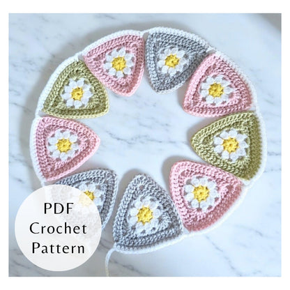 Crocheted triangle patterns with floral designs on a white background, featuring a PDF crochet pattern label.